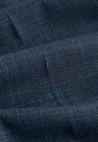 Dark blue textured fabric with a subtle weave, displaying a range of shades and a soft surface for a refined look.