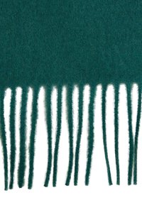 Écharpe en laine teal pr�ésentant une texture douce, avec des bords frangés pour un détail supplémentaire. Le tissu a un aspect dense et duveteux.