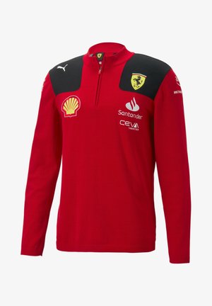 Rotes langärmliges Sweatshirt mit Reißverschluss, schwarzen Schulterpaneelen und mehreren Markenlogos, darunter Ferrari, Shell und Santander.