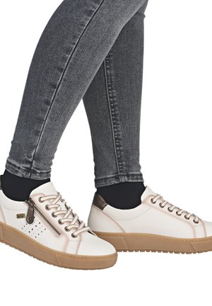 Casual white sneakers with beige accents, lace-up detail, and side zipper. Features a textured beige sole and small perforated design on the side.