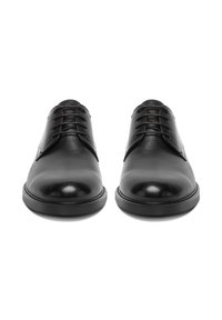 Pair of black polished leather formal shoes with laces, viewed from the front on a white background.