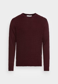 Burgunderfärgad stickad tröja med kabelmönster, rund halsringning och långa ärmar med ribbade mudd och nederkant. Mjuk textur och avspänt design.