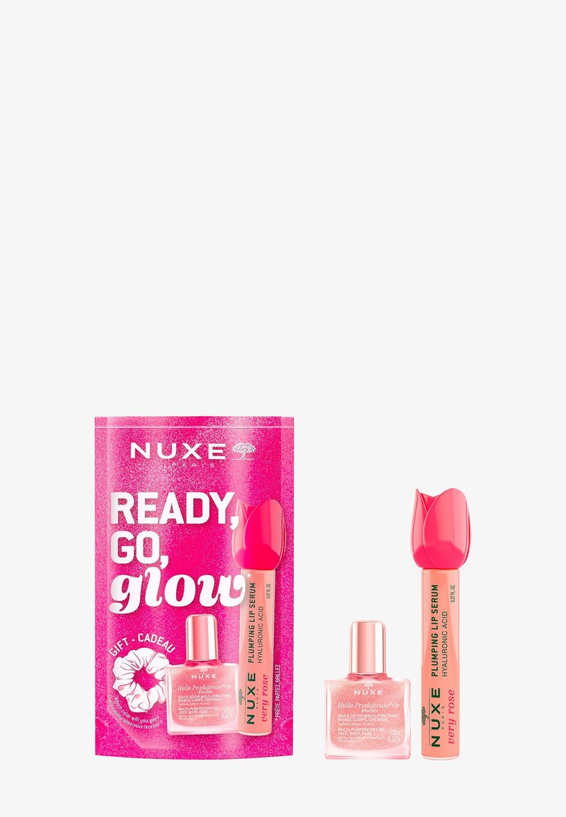 Coffret cadeau NUXE Ready, Go, Glow avec huile éclat multi-usages et sérum repulpant pour les lèvres avec un capuchon en forme de rose.