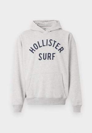Sweatshirt capuz cinza claro com bolso frontal e texto azul marinho "Hollister Surf" no peito.