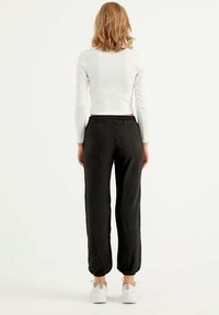 Herita Träningsbyxor - black