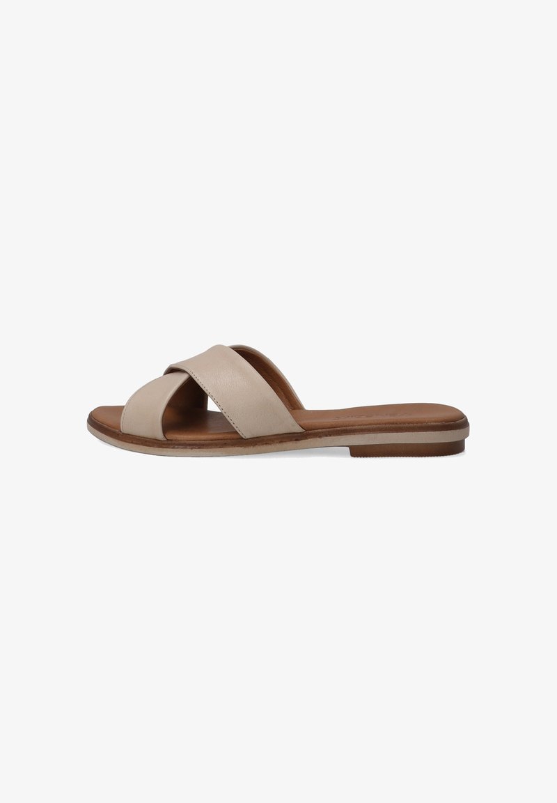 Beige læder slide sandaler med krydset stropdesign, flad sål og en brun tekstureret indersål, velegnet til afslappet brug.