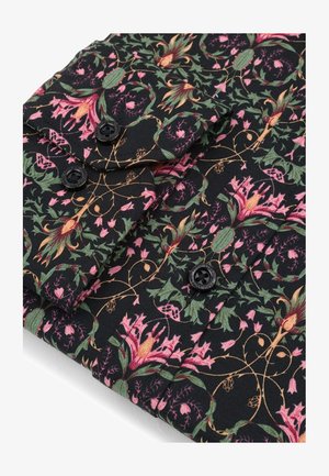 Czarna tkanina z kwiatowym wzorem w różu i zieleni. Posiada czarne guziki oraz teksturowaną powierzchnię z detalicznymi wzorami winorośli.