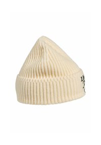 White knitted beanie hat featuring vertical ribbing, pointed top, and a small logo printed in black on the side. Soft texture.
