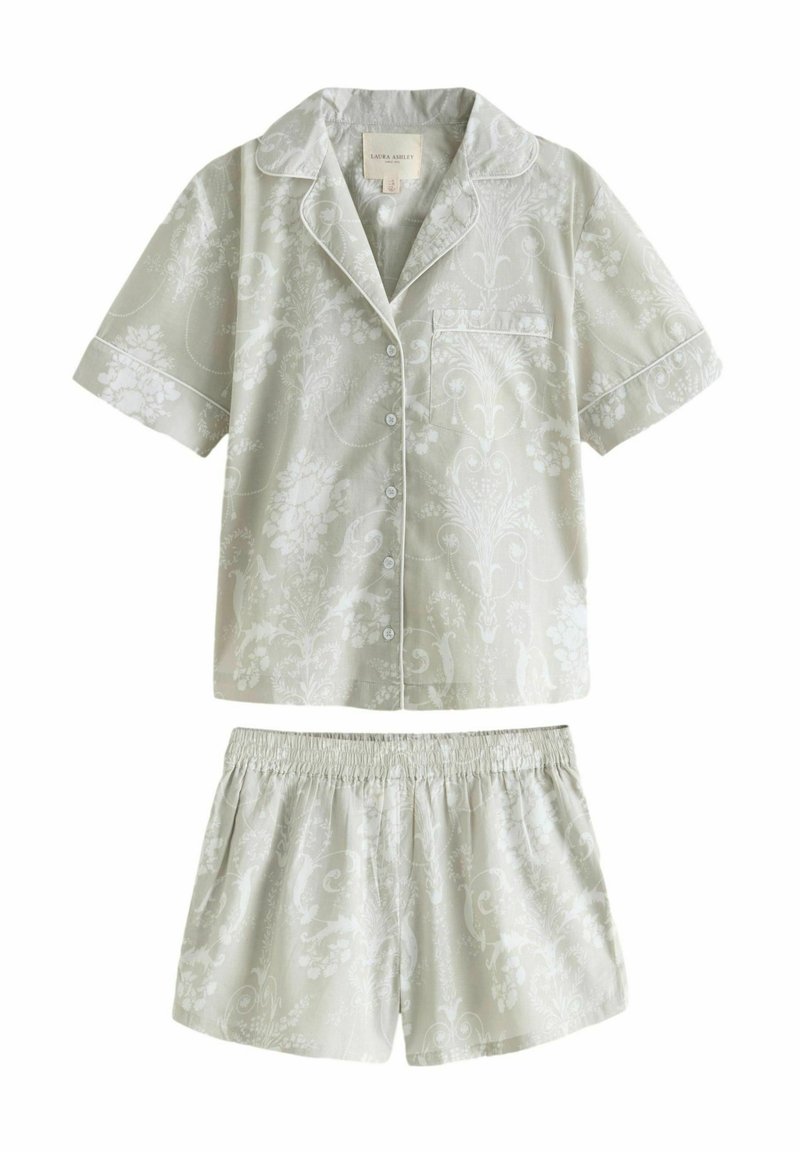 Vaaleanharmaa pyjama-asuste, jossa on lyhythihainen paita ja shortsit. Kukallinen kuvio, napit edessä ja taskudetaili paidassa. Elastinen vyötärö shortsissa.