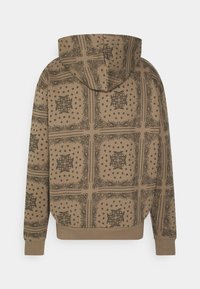 Felpa con cappuccio in tessuto marrone decorata con intricati motivi paisley neri e geometrici, polsini a costine e un taglio rilassato.