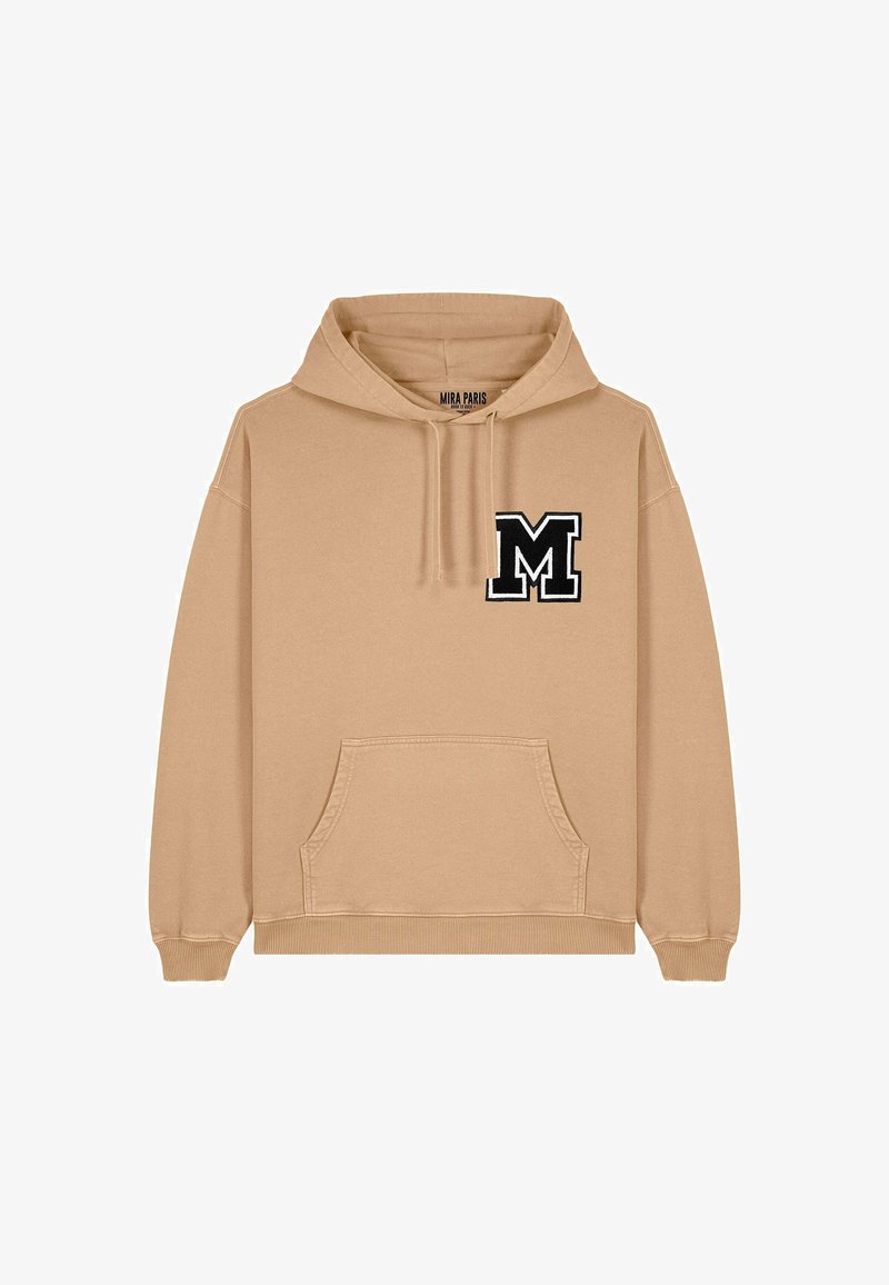 Bézs színű kapucnis pulóver, elülső kenguruzsebbel, állítható kapucnival és fekete hímzett "M" betűvel a bal mellkasán. Puha pamut keverék anyag.