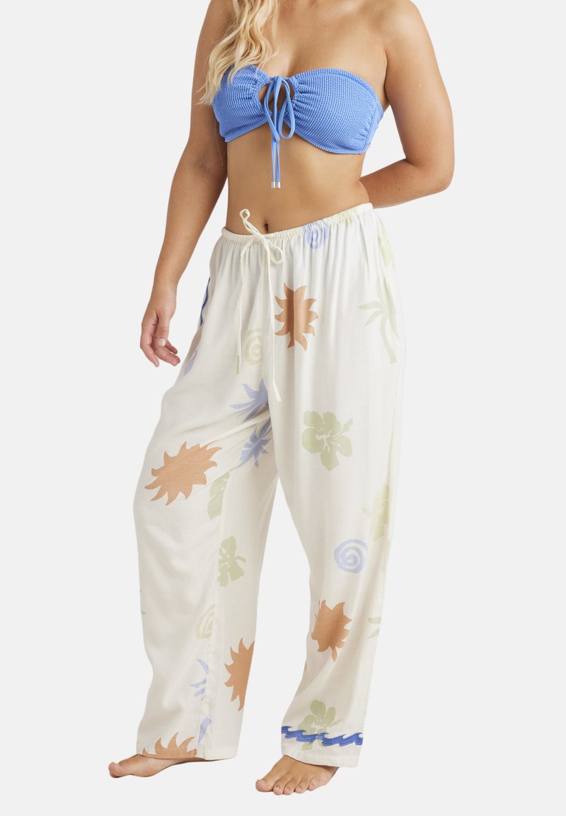 Lightweight, cream-colored pants with a relaxed fit. Features various floral patterns in orange, green, and blue, with a blue accent at the hem.