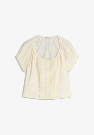 Bluzka na guziki w jasnym kremowym kolorze. Posiada krótkie bufiaste rękawy, dekolt w kształcie litery U oraz teksturowany przód z falbankami i guzikami. Miękka tkanina.