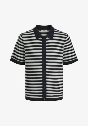 Kortermet strikket polotrøye med marineblå og hvite horisontale striper, med knappestramming foran og flat krage. Teksturert stoff.