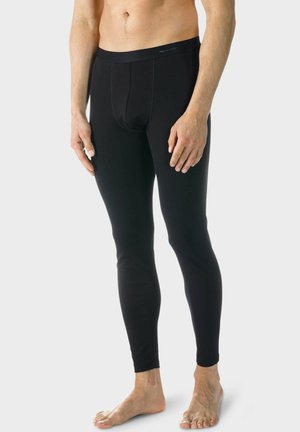 Schwarze Baumwollleggings mit enger Passform, ausgestattet mit einer Vordertasche, flachen Nähten und einem elastischen Bund, die für Komfort und Bewegungsfreiheit entwickelt wurden.