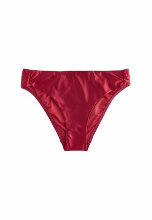 Červené dámske spodné diely plaviek z hladkej, mierne lesklej látky s elastickými stranami na bielom pozadí.