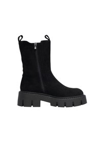 Black suede ankle boot with a chunky rubber sole, side zipper, pull tabs, and a smooth texture. Features a rounded toe and minimal stitching details.