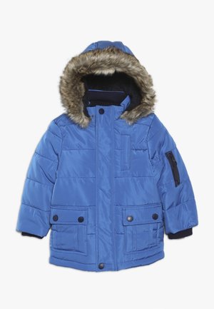 Veste d'hiver rembourrée bleue avec capuche doublée de fourrure, poches à boutons à l'avant et poche zippée sur la manche, conçue pour le temps froid.
