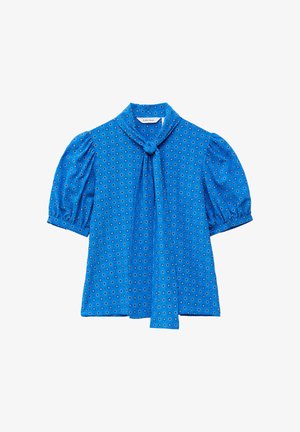 Blouse bleu à manches courtes bouffantes, motif circulaire, avec un nœud à nouer à l'avant du col sur fond blanc.