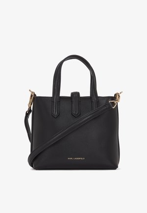 Mustmust nahk käekott struktureeritud kujundusega, lühikeste käepidemete, eemaldatava õlavööd ja kuldse logo aksendiga põhjas. Omab siledat tekstuuri.