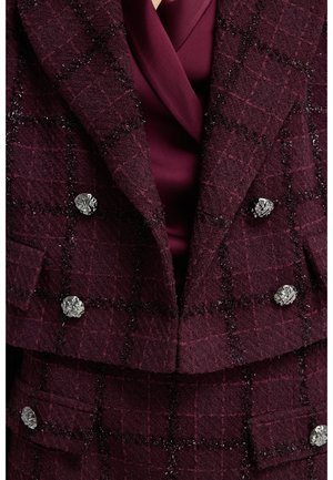 Burgundy tweed jacket with a check pattern, double-breasted design, silver floral buttons, and a smooth maroon inner lining.