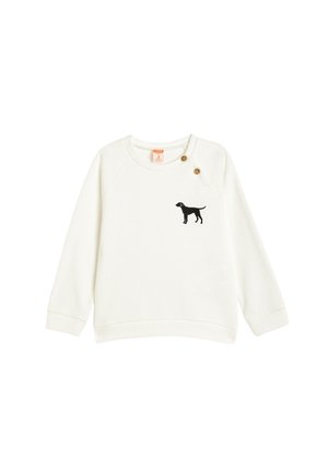 Sudadera blanca de manga larga, con textura acanalada, que presenta un diseño de la silueta de un perro negro bordada en el lado izquierdo del pecho y acentos de botones de latón.