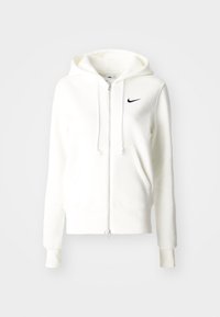 Vit zip-up hoodie tillverkad av mjukt tyg, med en svart Nike-logotyp på bröstet, och en huva med dragsko samt kängurufickor.