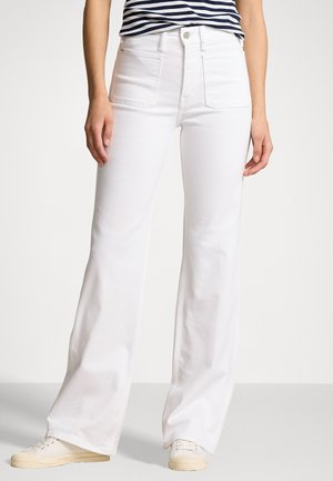 White wide-leg jeans with a high waist and two front pockets, paired with a navy and white striped shirt. Textured fabric, plain design.
