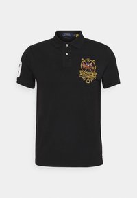 Black polo shirt made of cotton, featuring a yellow embroidered emblem on the chest and a white number "8" on the sleeve. Classic fit.