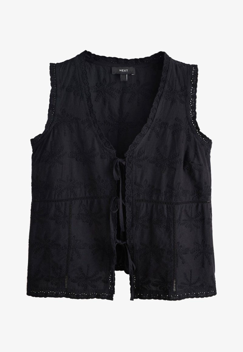 Veste noire sans manches avec broderie florale, bords festonnés et liens à l'avant de la marque NEXT.