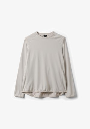 Camiseta de manga larga color beige claro con cuello redondo y mangas raglán, con un dobladillo ligeramente fruncido, mostrada extendida sobre un fondo blanco.