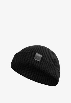 Black knit beanie with ribbed texture and a folded cuff, featuring a subtle logo patch in a rectangular shape on the front.
