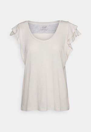 Helle beige Kurzarm-T-Shirt aus weichem Material, mit einem Rundhalsausschnitt und Rüschenakzenten an den Schultern entlang der Ärmel.