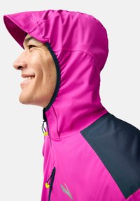 Fitted, bright pink hooded jacket with elasticized hood, navy blue shoulder accents, and adjustable drawstrings with yellow toggles.