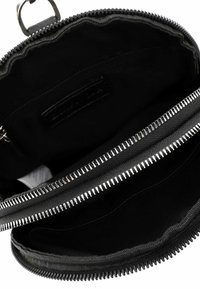 Black zippered wallet with dual compartments, smooth texture, metal zippers, and fabric lining. Interior features card slots and a pocket.
