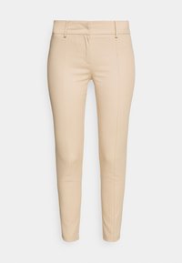 Beige tailored pants with a smooth fabric, slim fit design, front pockets, and horizontal seam details at the waistband.