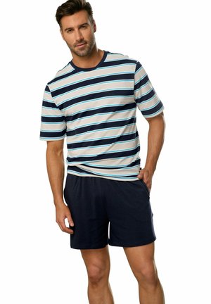 Striped short-sleeve shirt in navy, light blue, and cream; paired with dark navy shorts. Casual design with soft fabric and relaxed fit.