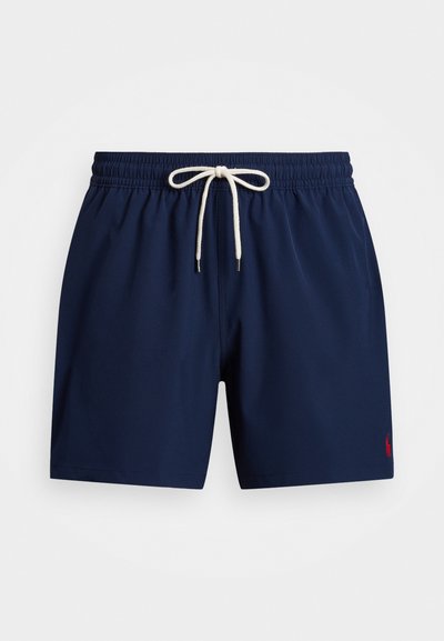 Jūriniai maudymosi šortai, pagaminti iš greitai džiūstančios medžiagos, su elastingu juosmeniu ir raišteliu bei mažo raudono logotipo akcentu.