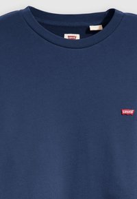 Navy blue cotton t-shirt with a crew neckline and ribbed texture. Features a small red Levi's logo on the left chest.