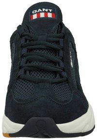 Navy blue athletic shoes with mesh and suede materials, featuring a lace-up design, padded tongue, and a rubber sole with a contrasting outsole.