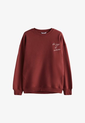 Bordeauxfarbener Sweatshirt mit geripptem Rundhalsausschnitt, überschnittenen Schultern und gesticktem Text "die Freuden des Herbstes" auf der linken Seite. Weiche Textur.
