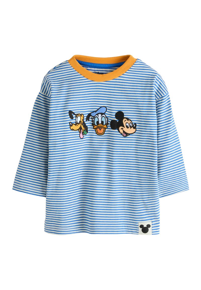 Modrá a biela pruhovaná košeľa s dlhými rukávmi a oranžovým golierom; obsahuje vyšívané hlavy Mickeyho, Donalda a Pluta. Zahrnutá malá nášivka s logom Mickeyho.