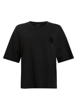 T-shirt in cotone nero con vestibilità morbida, maniche corte e scollatura rotonda. Presenta un logo tono su tono sul petto.