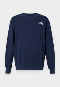 Navy blue sweatshirt made from soft fabric, featuring a round neck, long sleeves, and a white logo on the chest. Smooth texture and simple design.