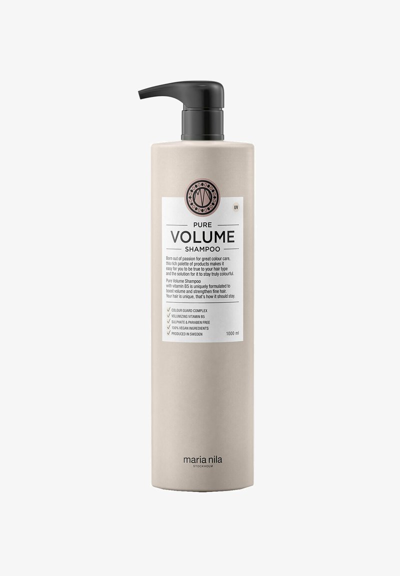 Pure Volume Shampoo in een hoge, beige fles met een zwarte pomp. Witte label toont productdetails en een logo. 1000 ml capaciteit.