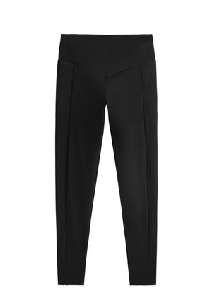 Leggings neri a vita alta, con una texture liscia e un design piegato unico davanti per un tocco di originalità.