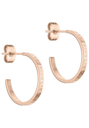 Rose gold hoop earrings with embossed "SBE KIND" text, circular shape, polished finish, stud fastening, and smooth texture.