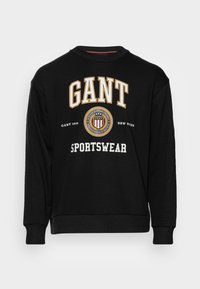 Czarny sweatshirt z bawełny, z napisem "GANT" i "SPORTSWEAR" w białym i złotym kolorze, z okrągłym dekoltem i ściągaczami przy rękawach.