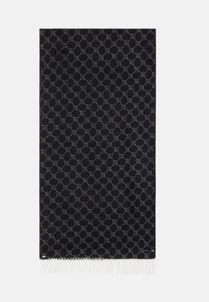 Black fabric blanket featuring a repeating geometric pattern and fringed edges. The design has a subtle texture and is primarily dark in color.