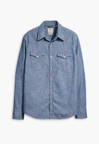 Sininen chambray-paita, jossa pitkät hihat, terävä kaulus, kaksi rintataskua ja nepparikiinnitys. Sileä pinta, jossa lievä kiilto.